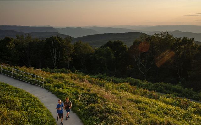 Children run on a path in a protected, conservation area in Kentucky.
