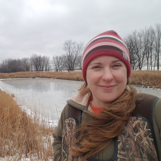 Krista Kirkham in a field during winter.