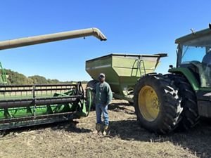Farmer Roger Smith takes a break from harvesting soybean