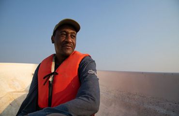 a man in an orange lifevest.