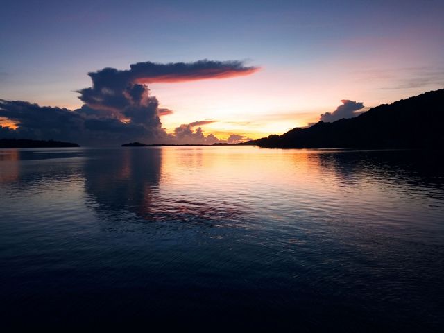 A dawn sky over a water view.