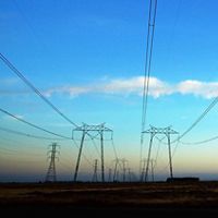 Photo of transmission wires across a California landscape.