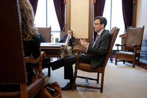 People sitting at a table for a meeting. 