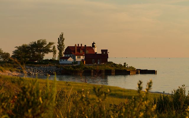 View of Point Betsie Lighthouse from the shore of Zetterberg Preserve at Point Betsie in Frankfort, Michigan.