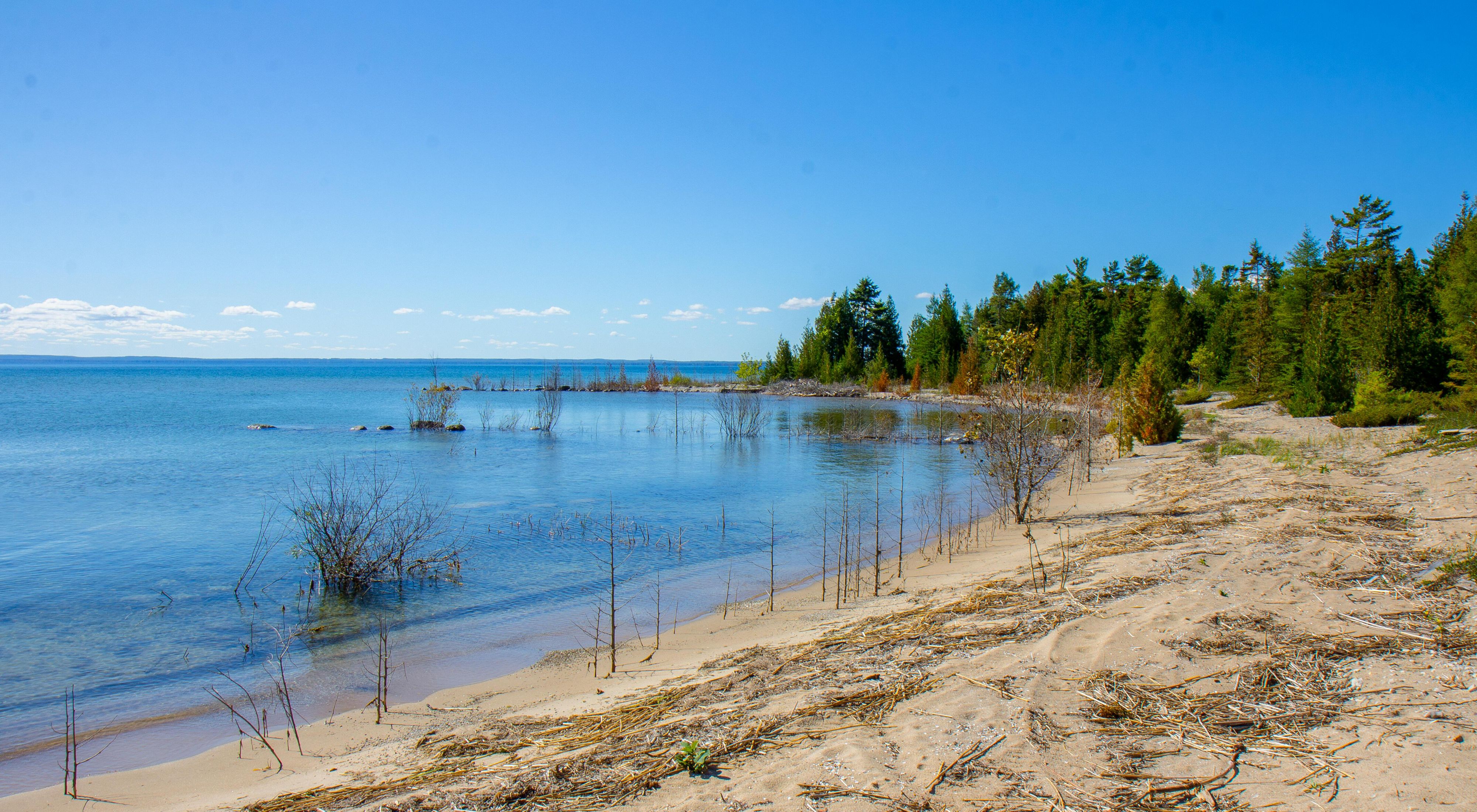 Looking out onto the clear blue water of Lake Huron from the coast of the North Point Peninsula.