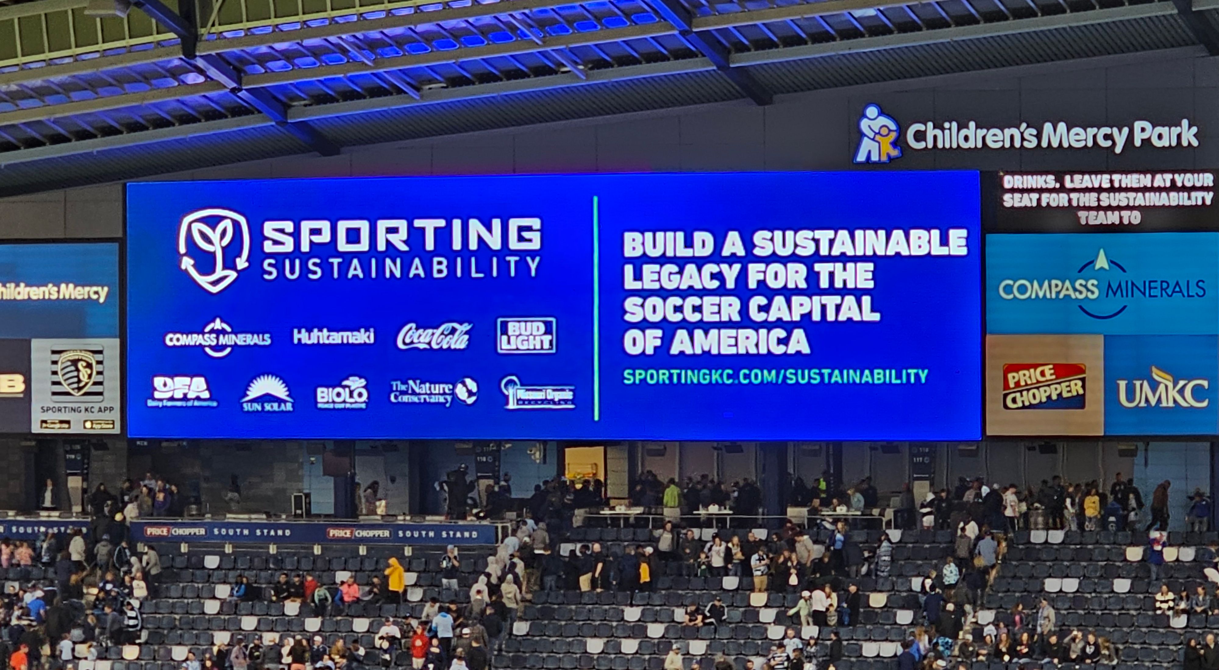 Sporting Kansas City scoreboard with platform partner logos on it.