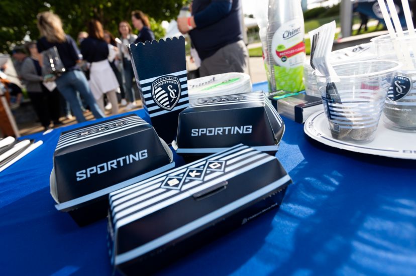 Food containers with the Sporting Kansas City logo and colors. 