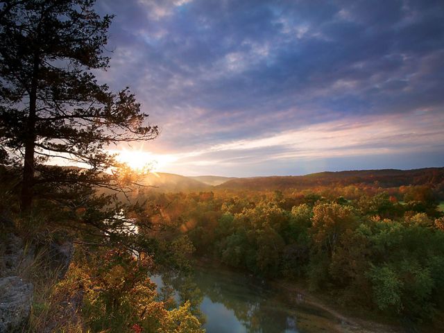 Soft light illuminates the forests along the Current River