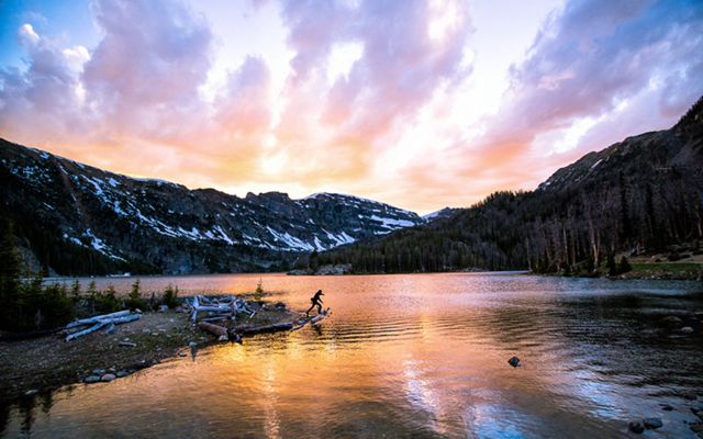Colorful sunset during a warm summer night at South Meadow Creek Lake in the Tobacco Root Mountains, Montana.
