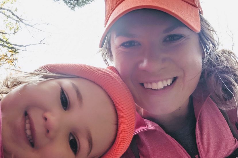 Molly Payne Wynne takes a selfie with her young daughter while exploring a forest.