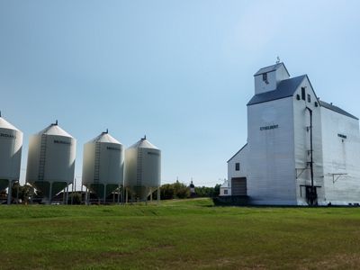 Grain silos in an agricultural landscape.