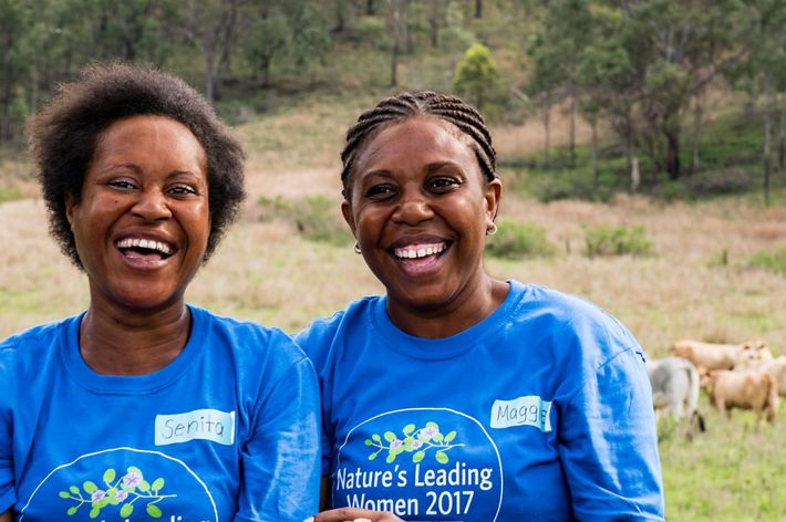 Two women smiling.