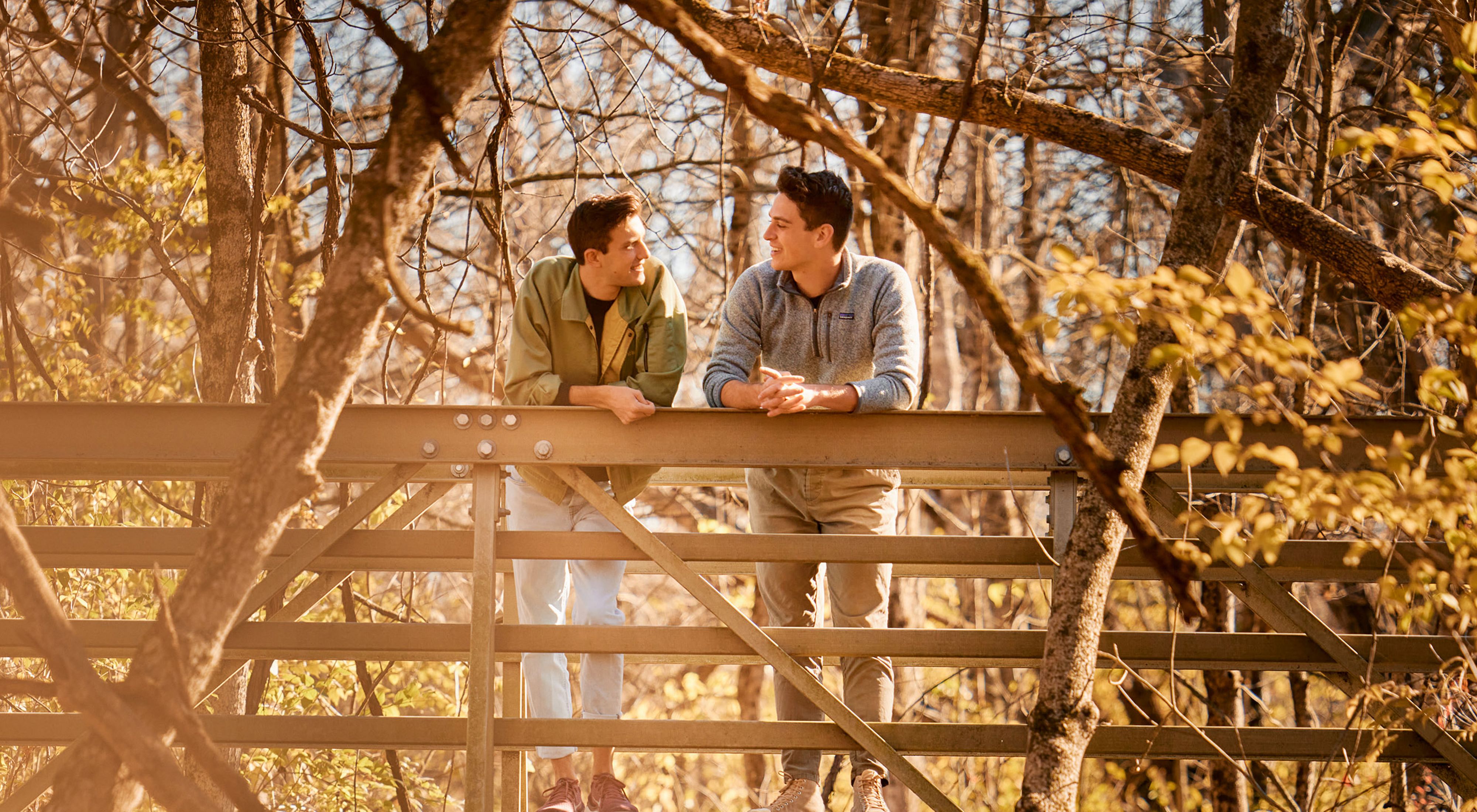 Chad Duplain stands with partner Matthew on bridge over stream at Big Darby Headwaters Nature Preserve.