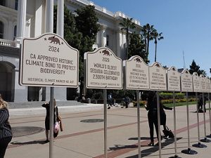 Sign installation on the steps of the California Capitol.