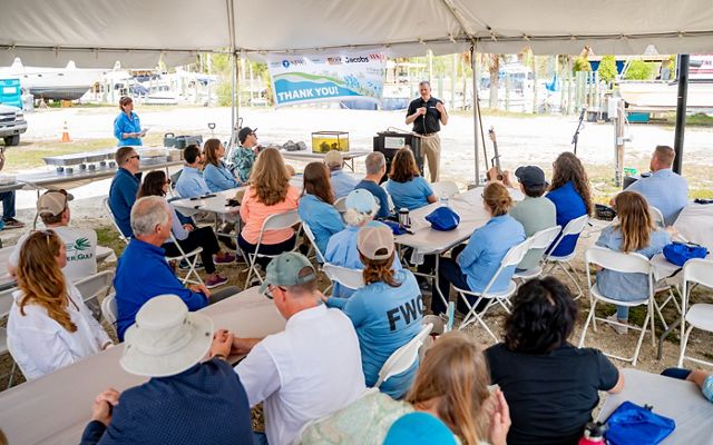 Stakeholders convening to celebrate new reef construction in Pensacola East Bay, FL. 