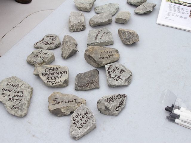 Piankatank River Oyster Recovery Project partners signed pieces of granite as part of a 2017 dedication ceremony for a newly constructed 25-acre oyster reef.