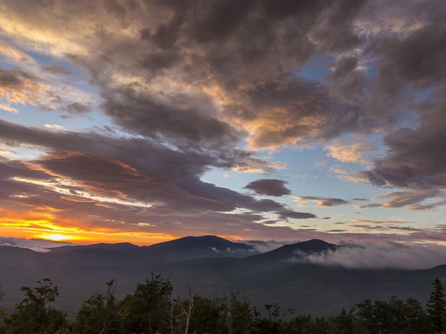 Sunrise over the Redington Forest of Crocker and Redington Mountains from Quill Hill in Redington Township, Maine, Appalachian Trail. 