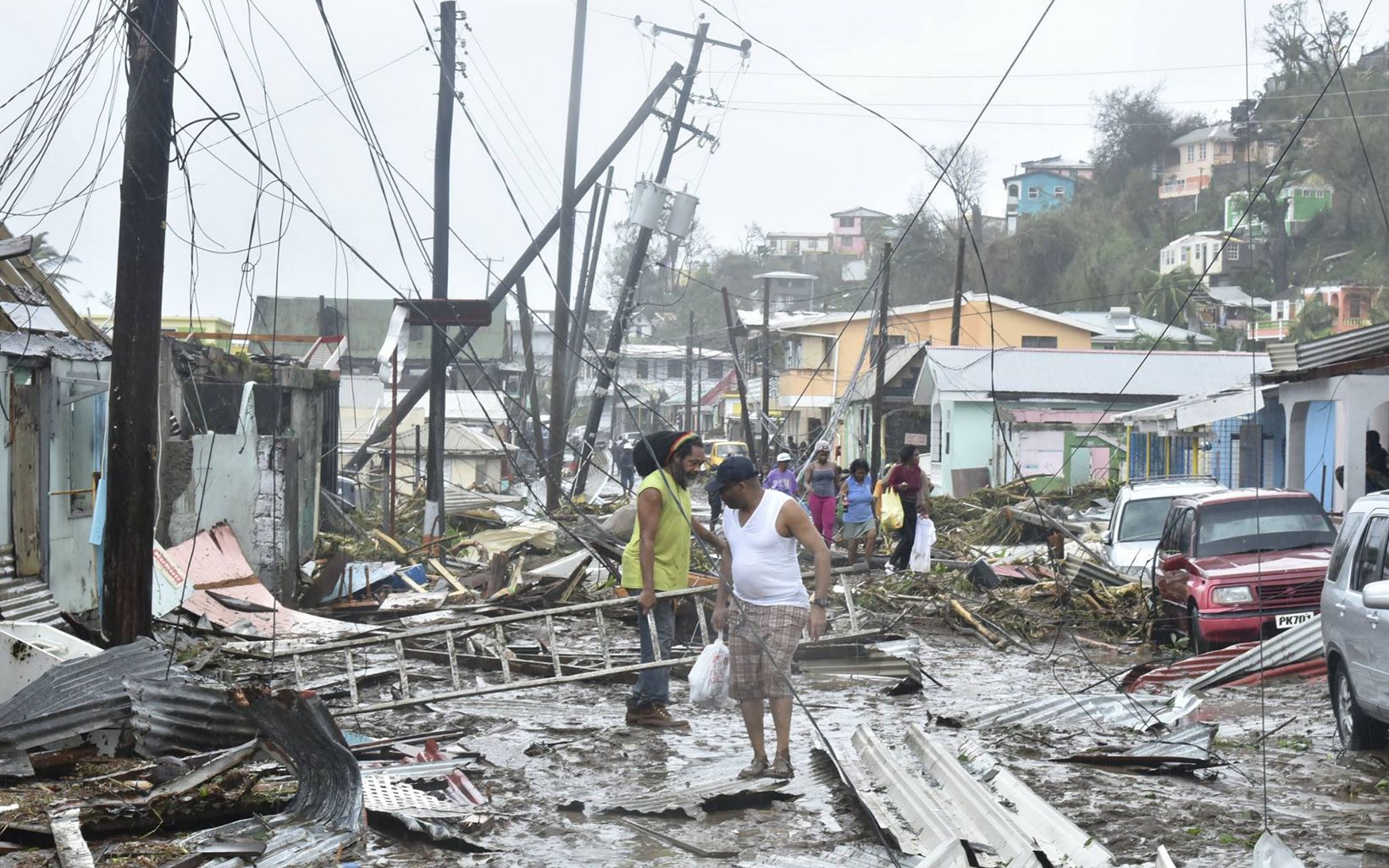 Residents of Dominica clear debris after Hurricane Maria
