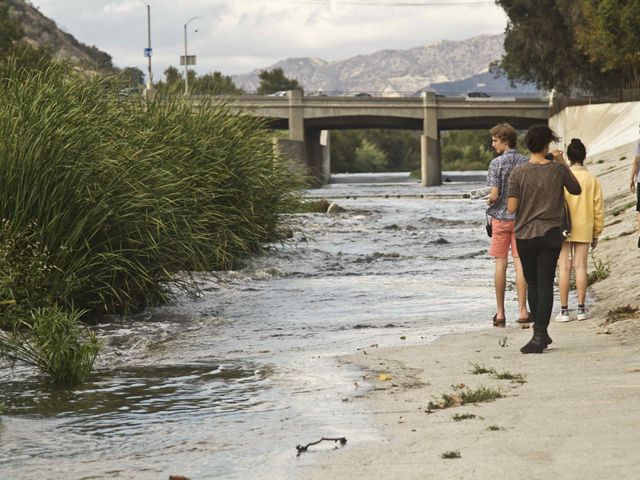 Walking along an urban river.