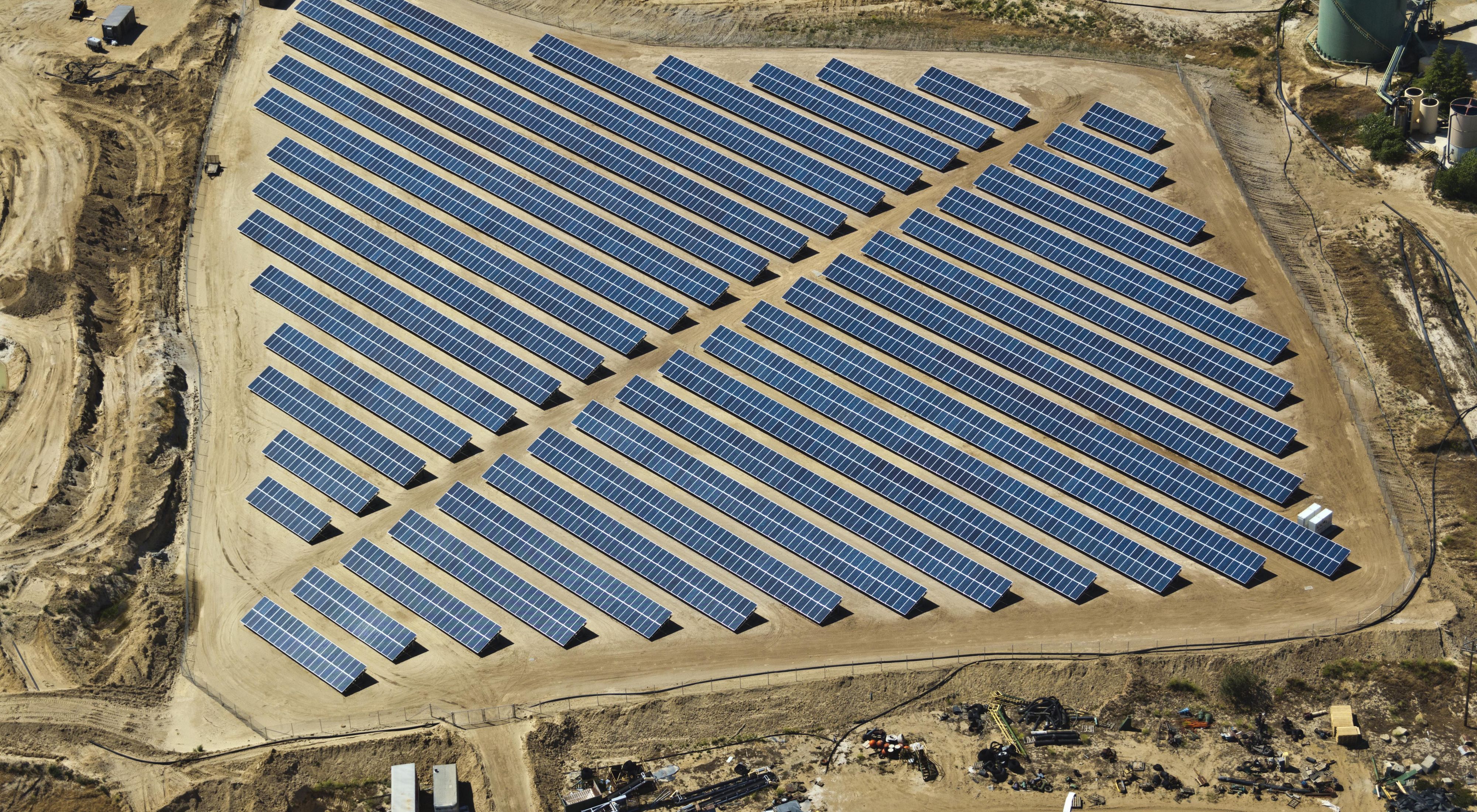 An aerial view of an array of solar panels at a quarry near Byron California.