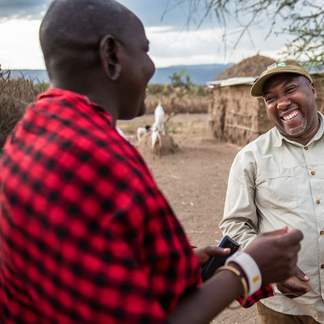 Herder Naronyo Nang’oiho (left) talks to TNC Grazing Manager Francis Msollo at his home in Selela village, northern Tanzania. 