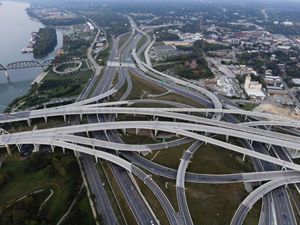 Aerial image of highways and roads overlapping at major intersection. 