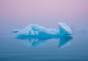 Iceberg drifting in a body of water.