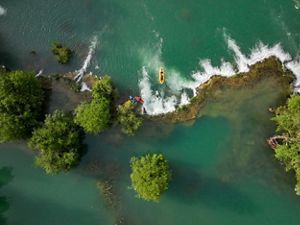 Aerial image of kayakers in a river