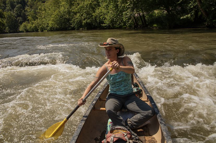 A woman canoeing on the Clinch River. 