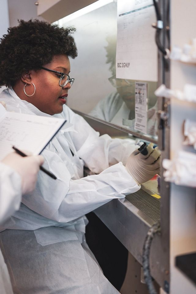 Dr. Tiara Moore works in a lab.