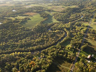 Early morning aerial photograph of the landscape, forest and farm fields along the Snake River just to the northwest of Mora, Minnesota.