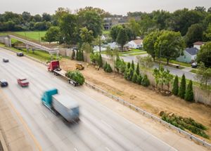 An aerial shot of Watterson Expressway as plants are brought in on a flatbed truck for installation along the highway in Louisville, Kentucky.