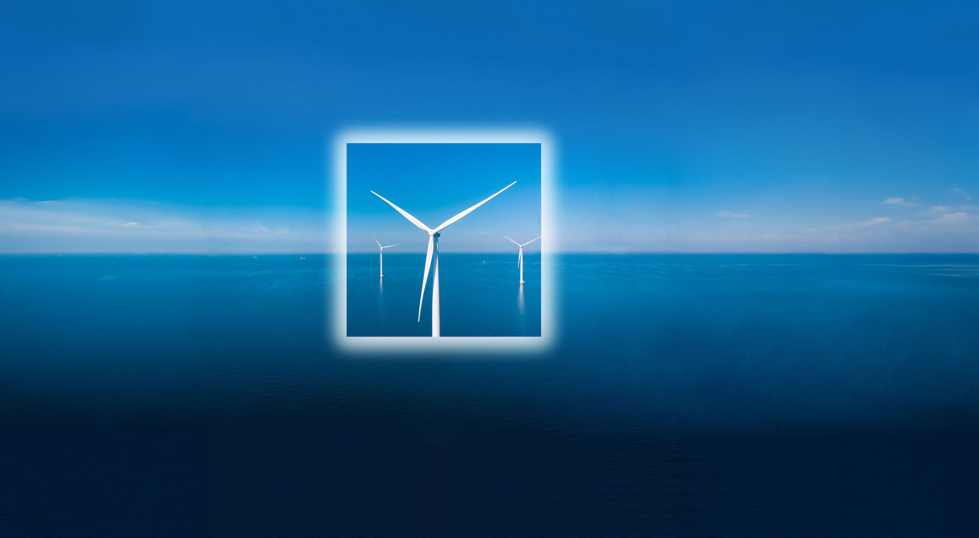 A wind turbine sits in the middle of  a blue ocean with a white square frame around it's body.