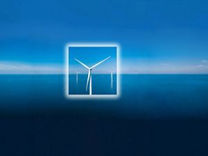 A wind turbine sits in the middle of  a blue ocean with a white square frame around its body.