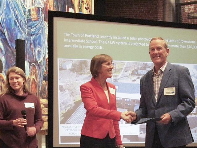 Photo of Adam Whelchel shaking hands with a member of Sustainable CT