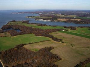 Aerial view of Chesapeake Bay with farmland beside it.