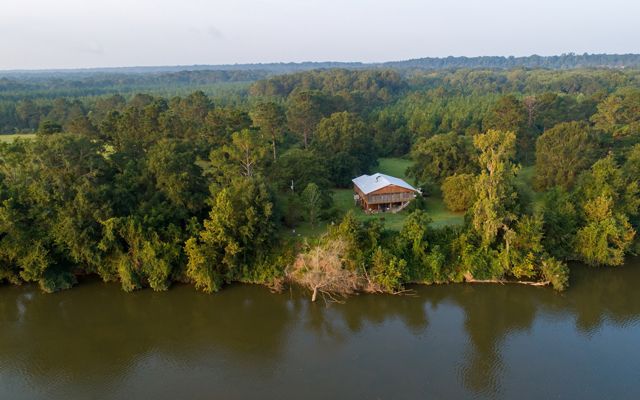 A home sits on the shores of the Alabama River.