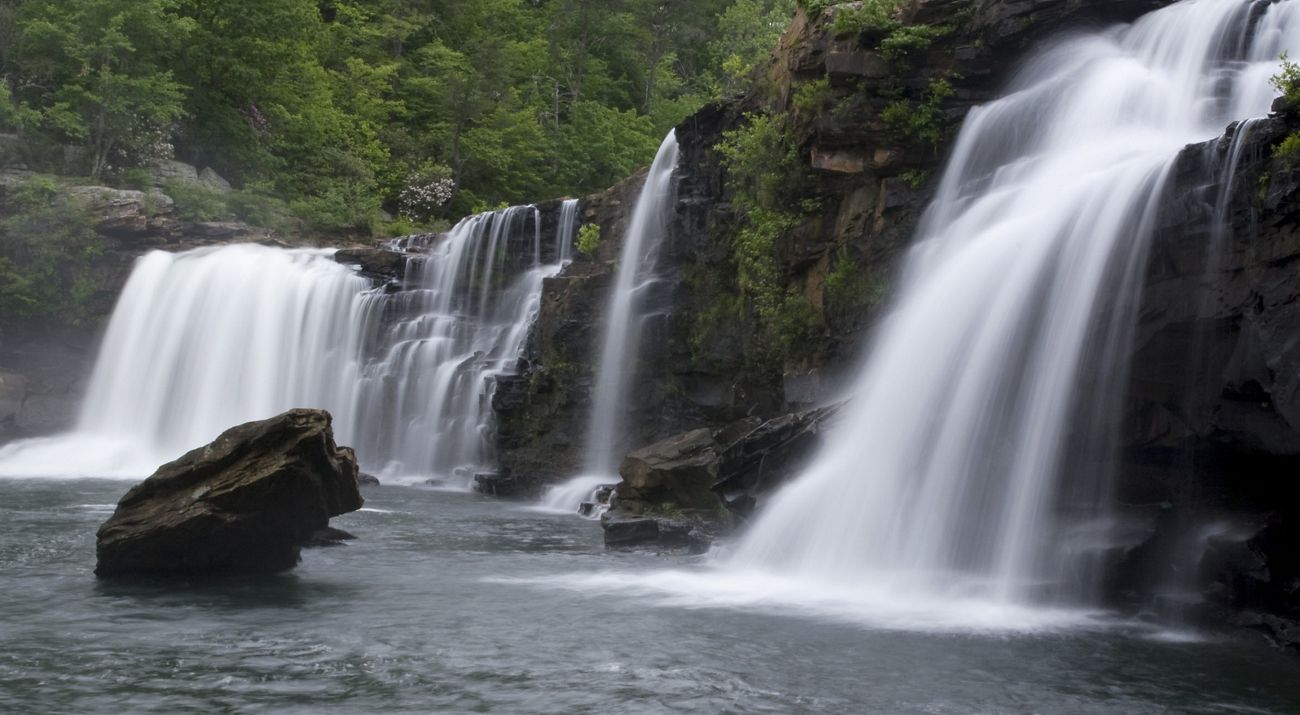 White waters fall over a rocks.