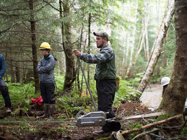 A local crew uses equipment to  restore a forest in Hoohah, Alaska.