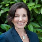 Alix Murdoch in a suit