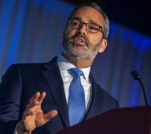 Photo of Andrew Bowman at a podium.