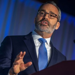 Photo of Andrew Bowman at a podium.