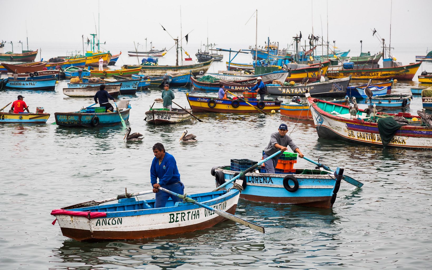 Fishermen set out to work in Ancón, Peru. Ancón is a small fishing town and seaside vacation destination about an hour north of Lima.  © Jason Houston