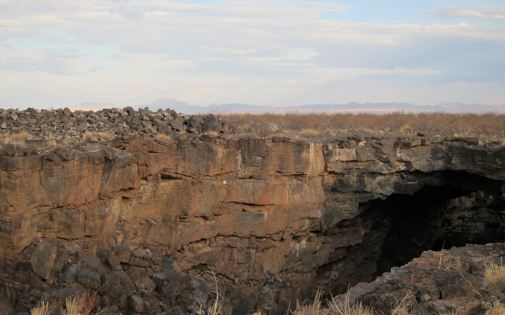 
                
                  Cave Entrance Eight million migratory bats use the Jornada Bat Caves as a stop-over site.
                  © Jackie Hall/TNC
                
              