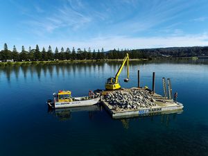 View of a large barge carrying shellfish shells.