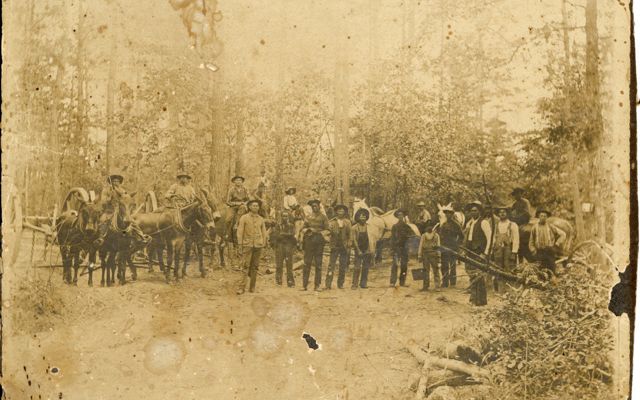 Old photo of timber company workers.