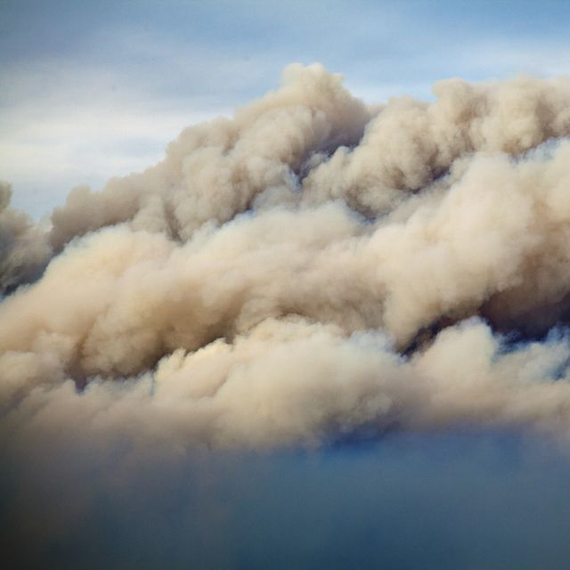 Smoke rises up during a devastating fire season in Australia. Climate change is contributing to these record fires. 