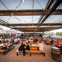 People enjoy the airy outdoor space of the Arizona Wilderness Brewing Company.