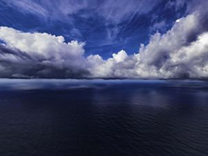 An ocean skyline with clouds.