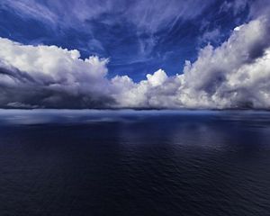 An ocean skyline with clouds.